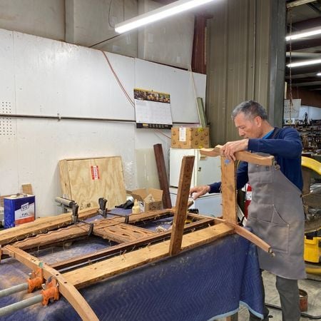Abel Sr reglues antique settee; furniture repair; furniture refinishing; raleigh, nc