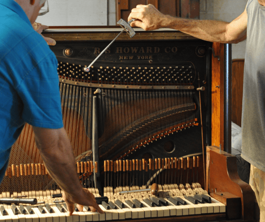 Chris and assistant repairing piano-2