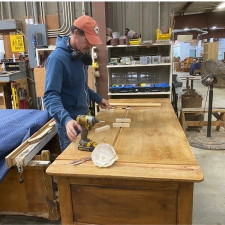 Cristian repairing badly split desk 1; antique furniture repair; wood furniture; raleigh, nc
