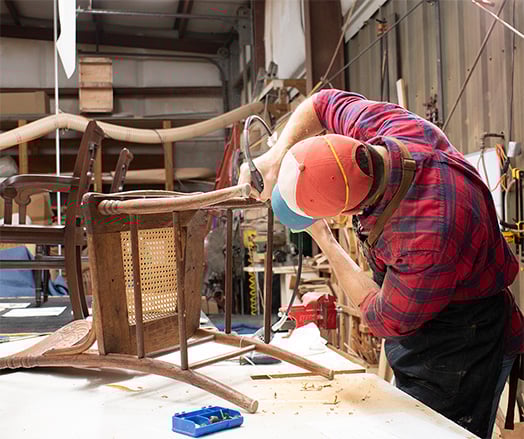 Cristian repairs a chair 524