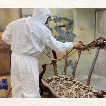 Furniture Refinisher Lacquering an Antique Settee Couch - wooden furniture refinishing