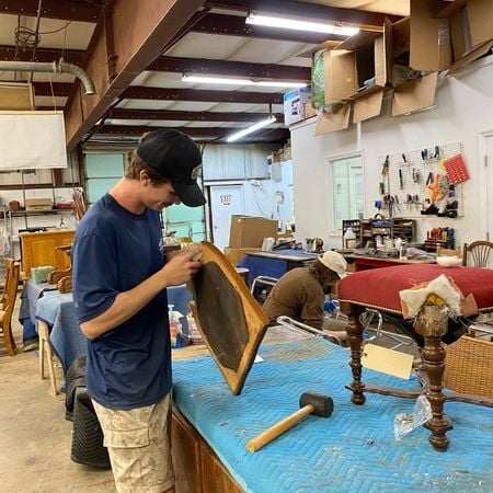 Luke sands a chair seat; furniture repair; antique repair; raleigh, nc