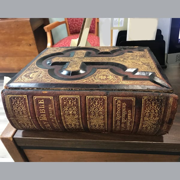 book repair restoration: black and gold bible spine after