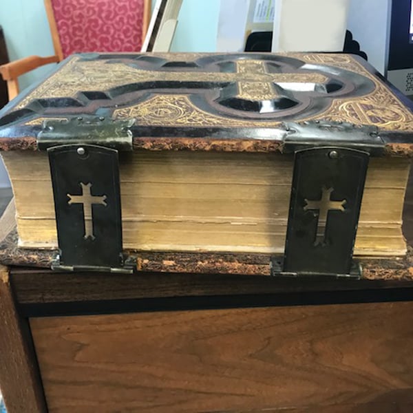 book repair restoration: black and gold bible text block after
