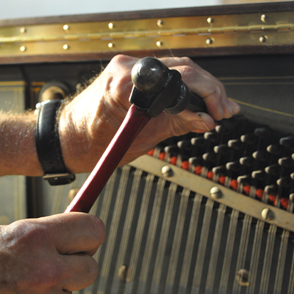 piano restoration: craftsmen working 6