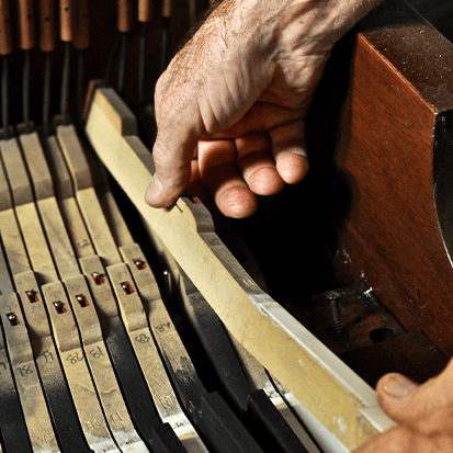 piano restoration craftsmen working 7