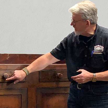 Bernard evaluations an antique chest - furniture repair