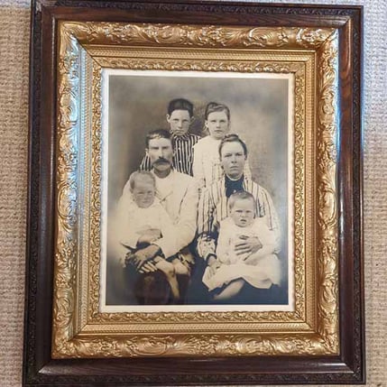 family portrait that suffered a fire, after restoration - fire and water damage restoration