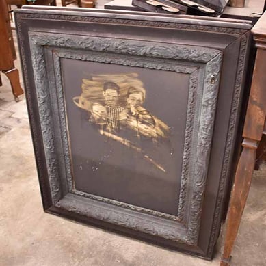 family portrait that suffered a fire, before restoration - fire and water damage restoration