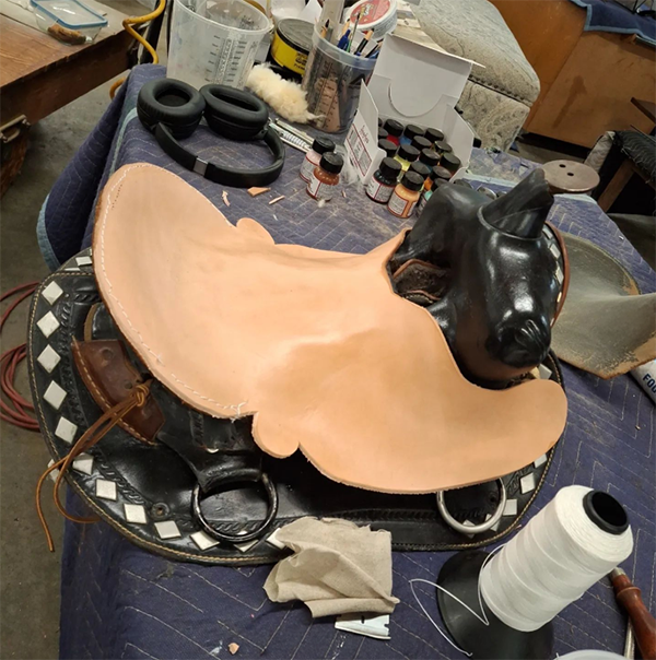 laying out new leather for saddle