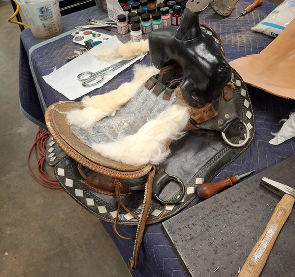 laying out new padding to go under leather for saddle