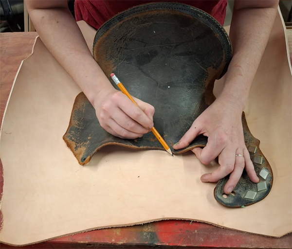 leather saddle in the beginning of repair, restoration, and leather tooling