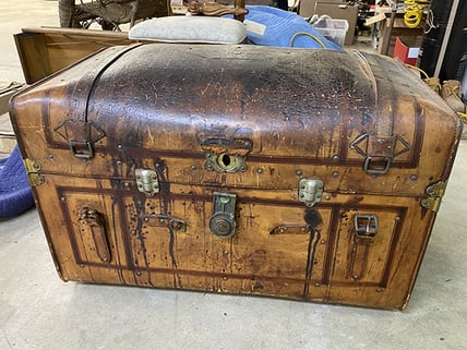 leather trunk before cleaning and restoration